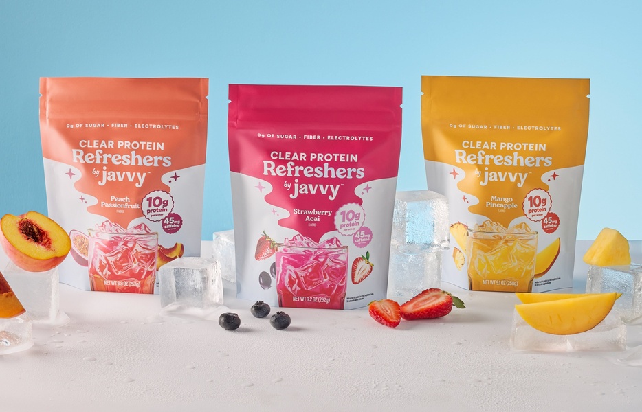 A clean, high-contrast studio shot showing three flavors of clear protein powder pouches surrounded by ice and fresh fruit on a light blue background.